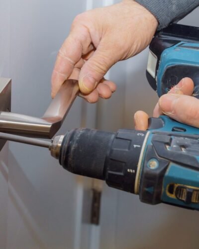 installation-locked-interior-door-woodworker-hands-install-lock-installation-of-the-door-lock-1-1-e1695975888430