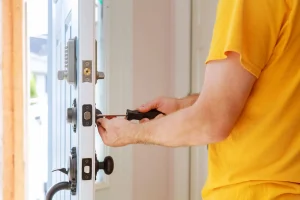 worker-installing-or-repairing-new-lock-handyman-repair-the-door-lock
