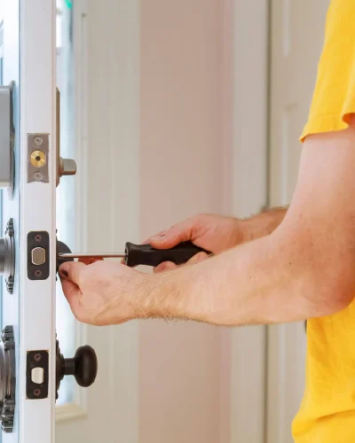 worker-installing-or-repairing-new-lock-handyman-repair-the-door-lock